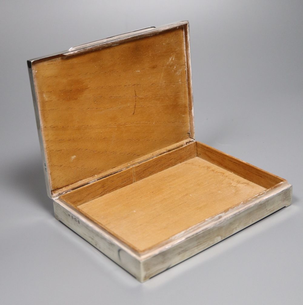 A George V part engine turned silver mounted rectangular cigarette box, William Adams Ltd, Birmingham, 1933, 16.1cm,